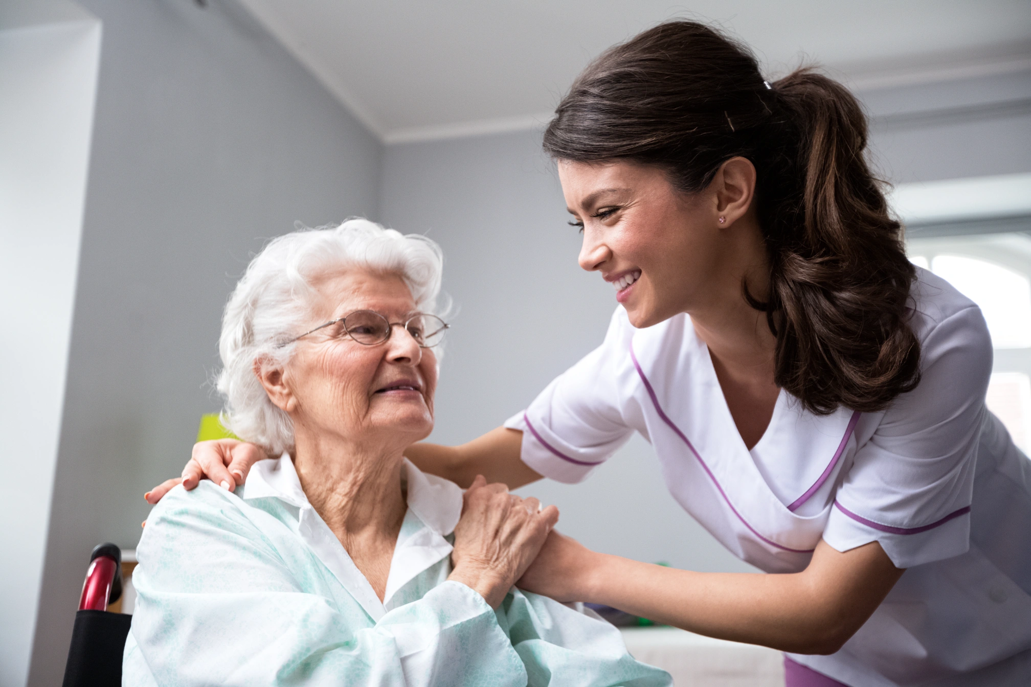 nurse and patient holding hands